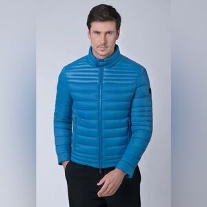 THE RECYCLED PLANET COMPANY 
Recycled Nylon Puffer Jacket - Mykonos Blue